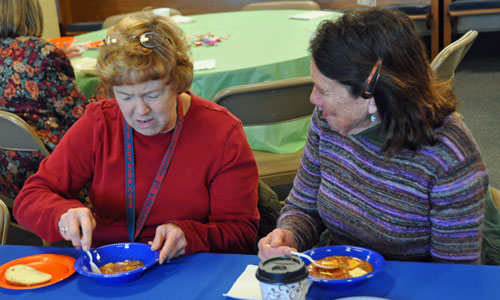 2 women eating soup